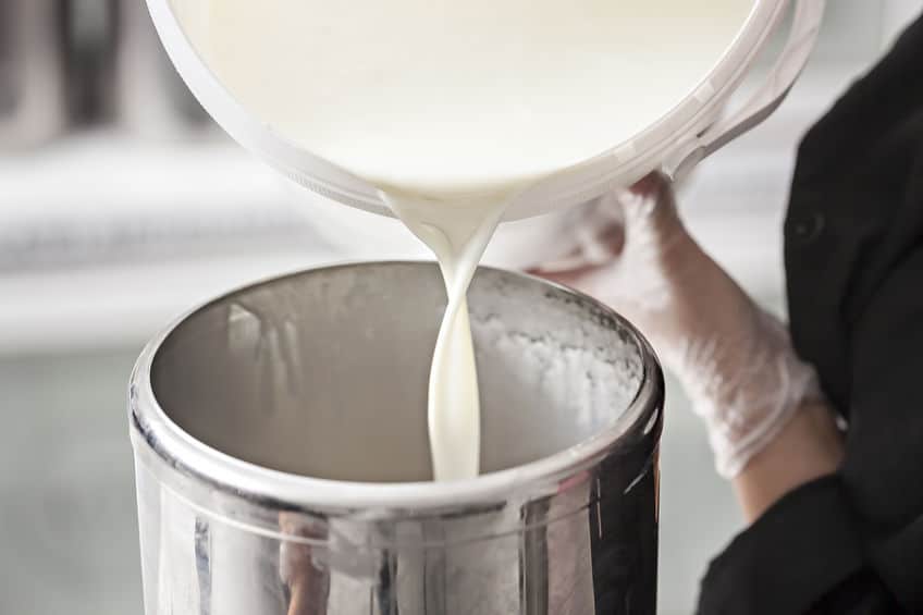 Pouring milk into bucket